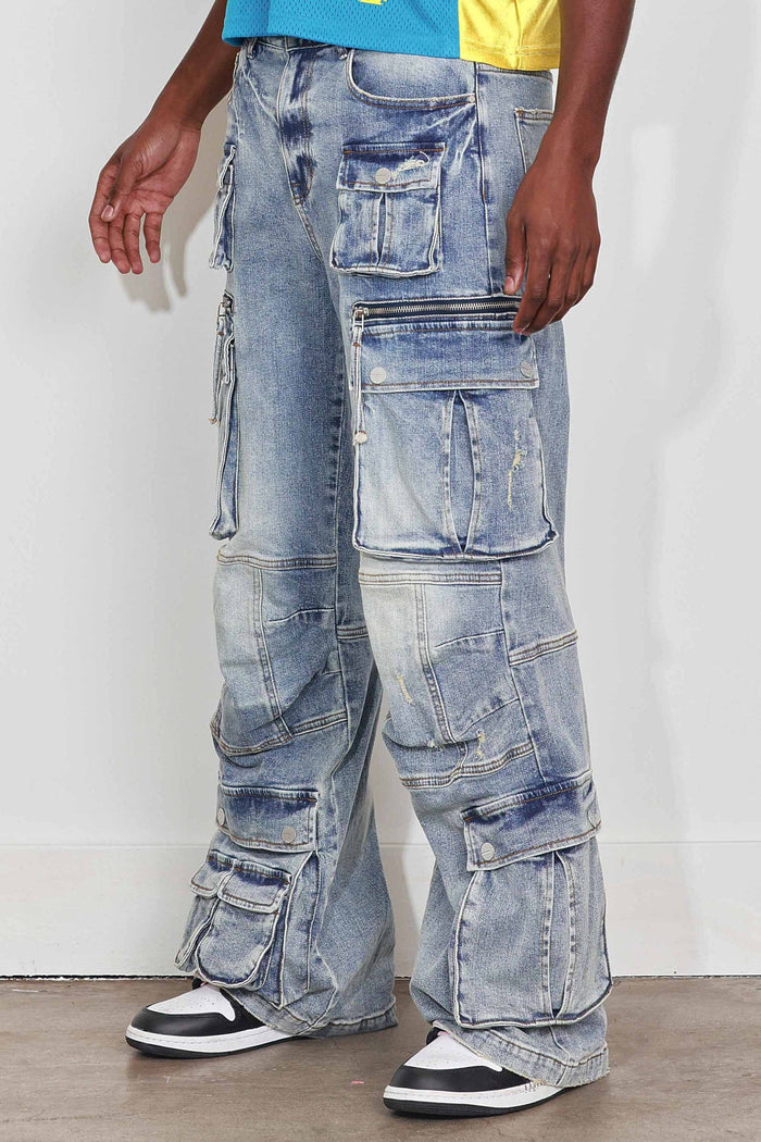 Light stone tint First Row Y2K multi cargo relaxed fit denim jeans, showcasing their denim fabric and casual style.