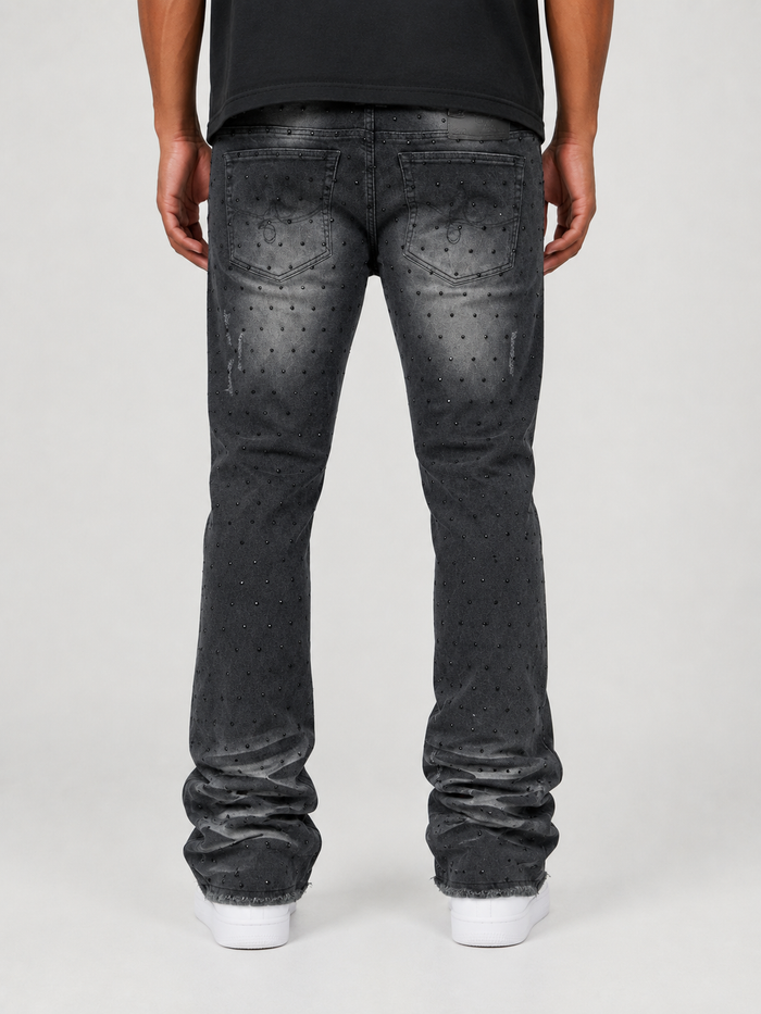 Frost Originals Amoto rhinestone stacked black denim jeans with distressed details and a fitted silhouette.