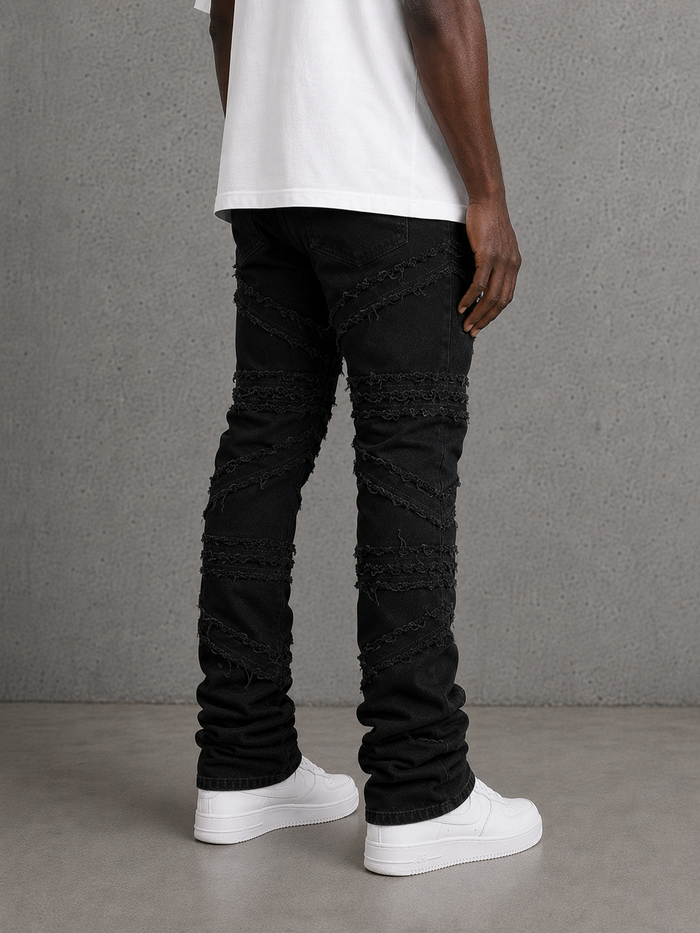FWRD Crossover Stacked Denim jeans in Jet Black showing the fit, layered design, and denim texture.
