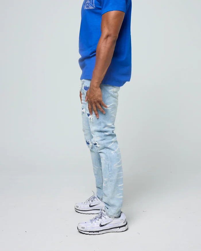 FWRD Crystal Denim in Ice Blue and Royal, stylish denim jeans with a classic fit, shown on a model with a neutral background.