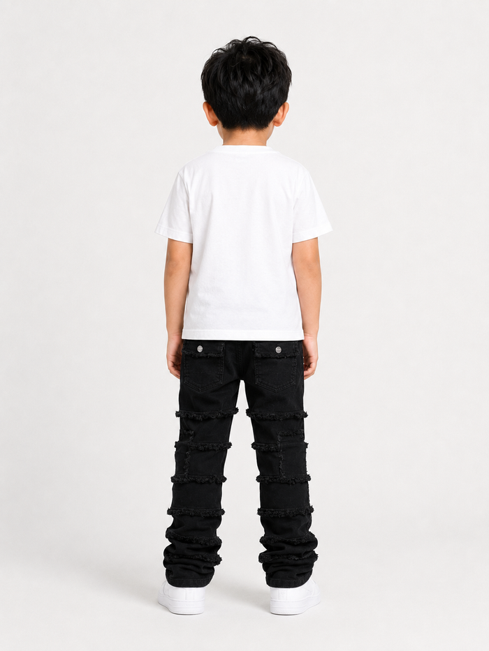 FWRD Kids stacked denim cargo pants in jet black, showcasing the denim fabric and relaxed fit style.