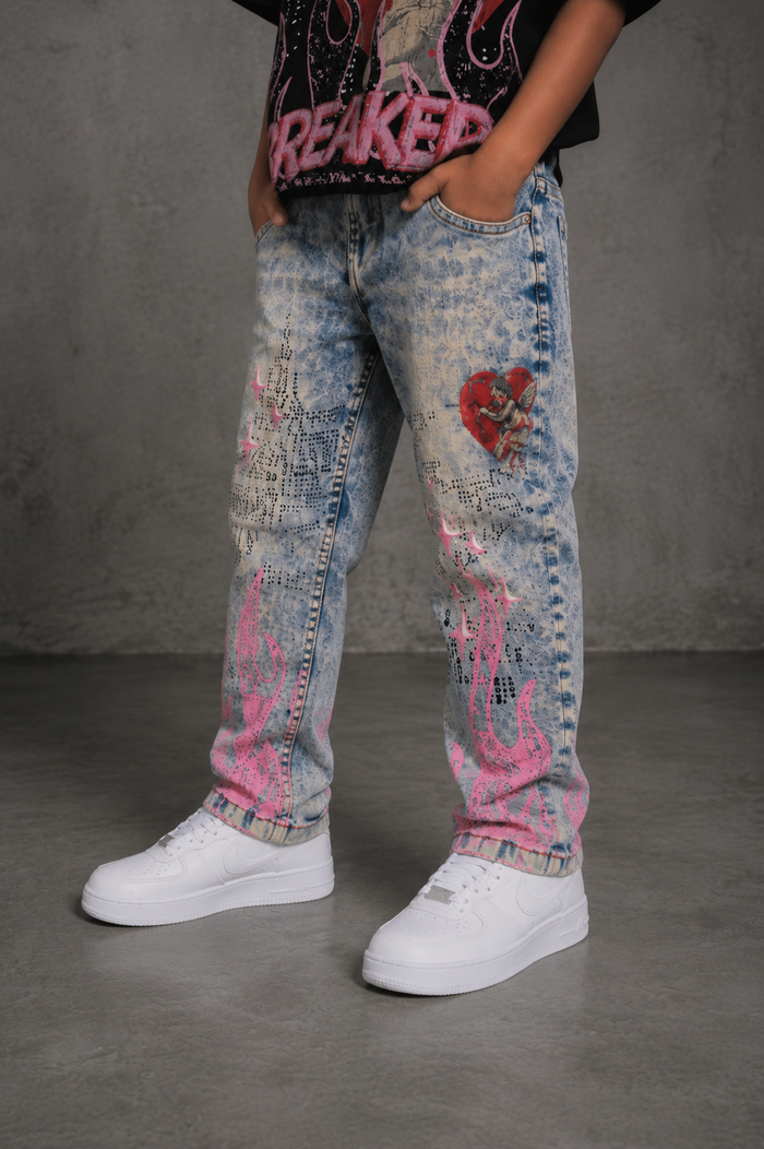 FWRD Kids Dreams slim straight denim jeans in light tint, showing a close-up of the light-colored kids' denim fabric and fit.