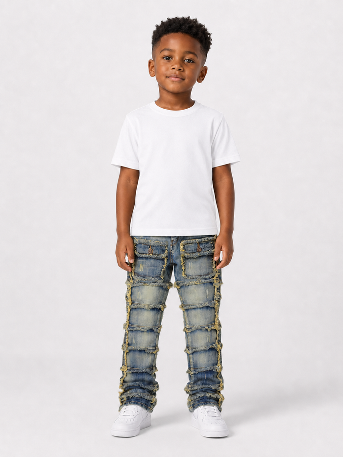 FWRD Kids Patchwork Stacked Denim jeans in light tint, featuring a layered denim design and patchwork details.