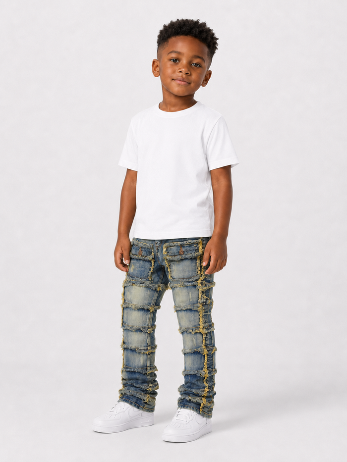 FWRD Kids Patchwork Stacked Denim jeans in light tint, featuring a layered denim design and patchwork details.
