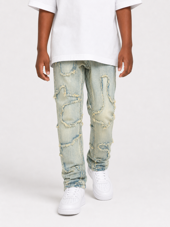 FWRD Kids Slim Wavy Denim in Ice Tint, showcasing the fitted, wavy style of the denim pants with a light blue color.