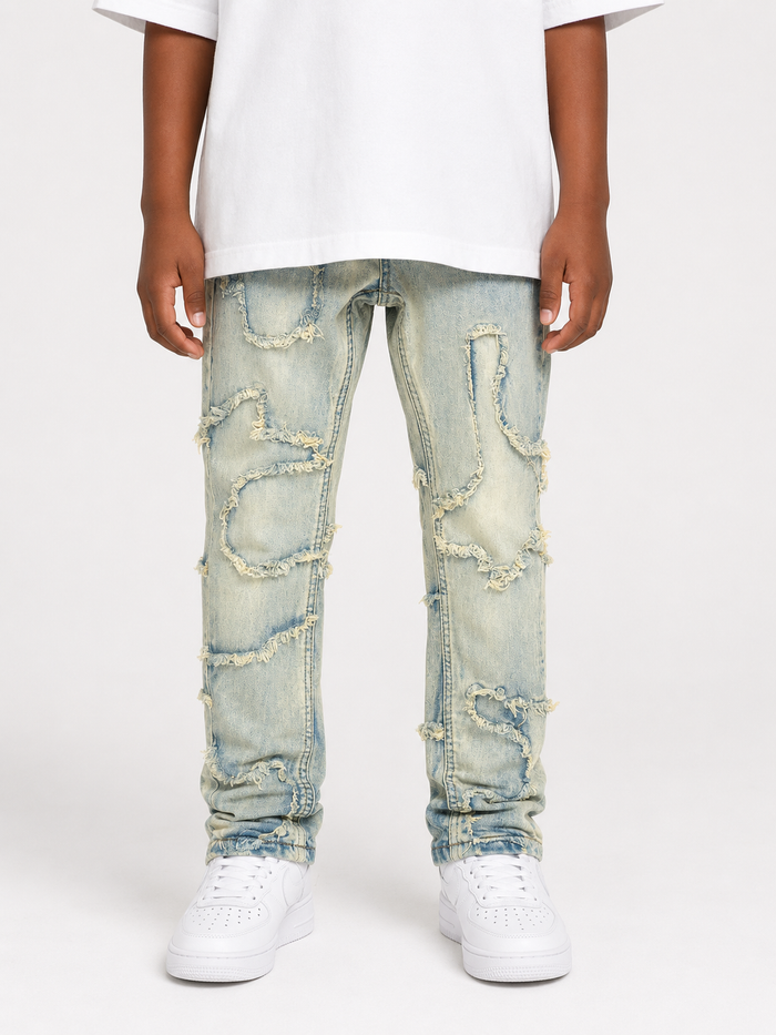 FWRD Kids slim wavy denim jeans in ice tint, showcasing the stylish fit and textured wavy design.
