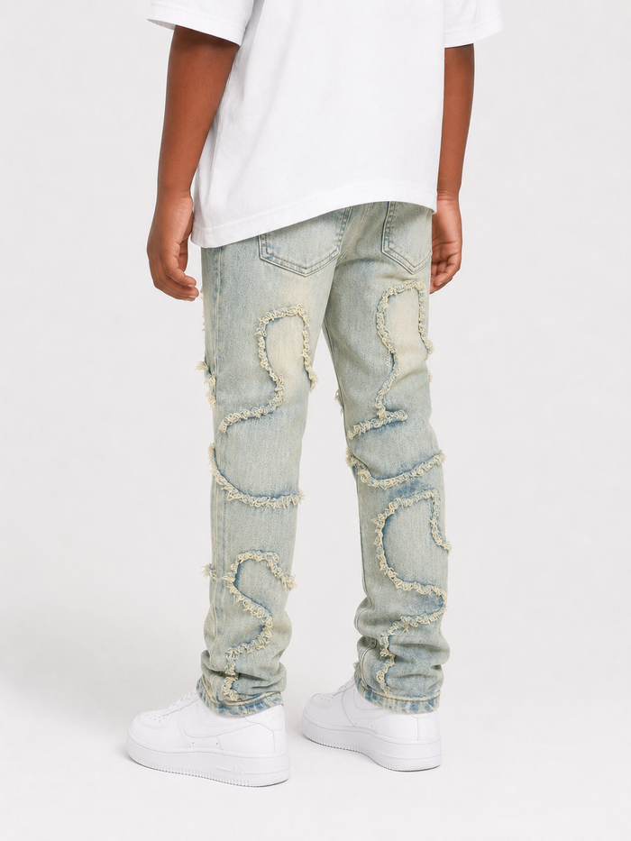 FWRD Kids Slim Wavy Denim jeans in ice tint, showcasing a fitted style with wavy texture and classic denim details.
