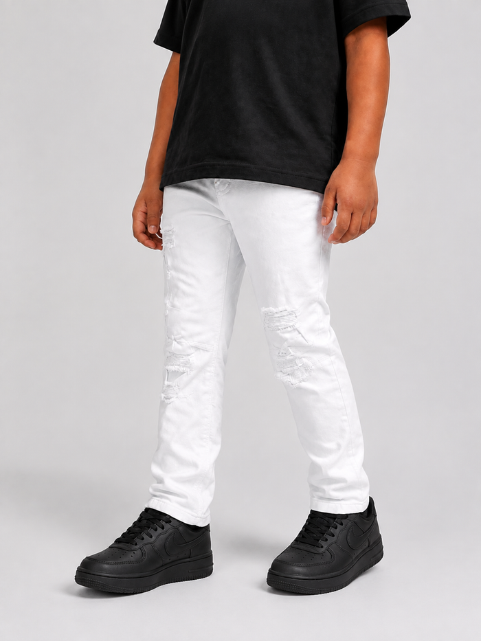 FWRD Kids washed-up denim jeans in white, showing front view with classic five-pocket design and relaxed fit.