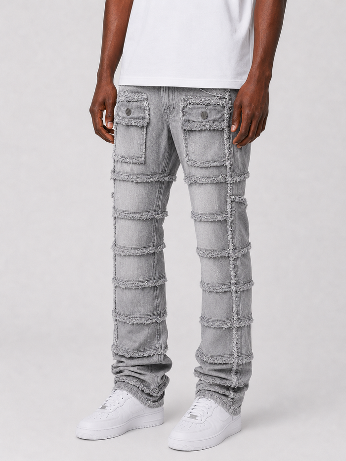 FWRD Patchwork True Stacked Denim jeans in grey with layered patchwork design and stacked leg style.