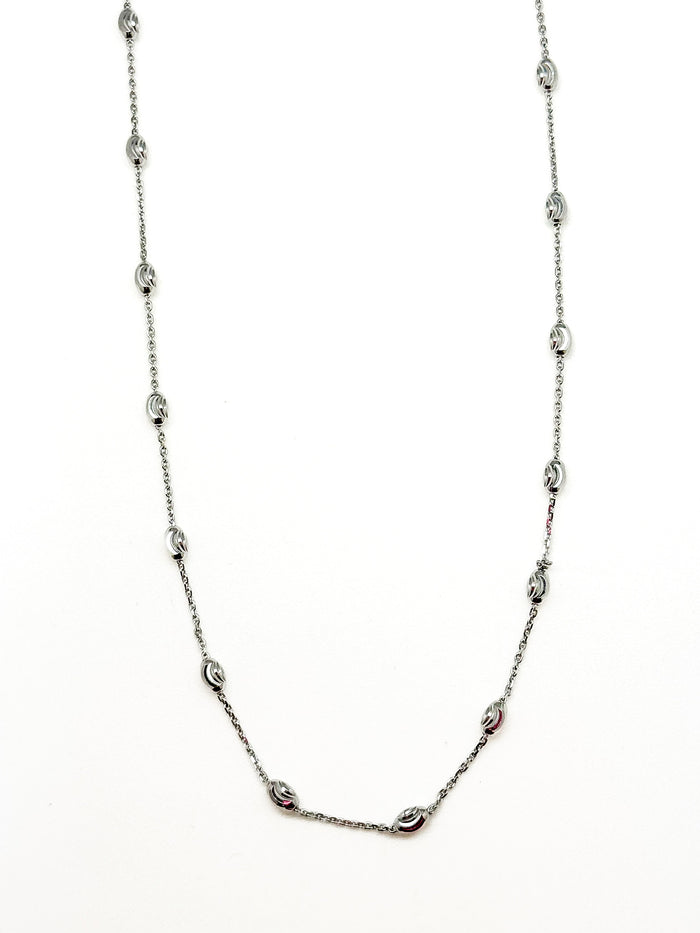 Silver chain necklace on a white background