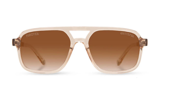 Camp Eyewear Grateful Dead Forever unisex sunglasses with a translucent champagne frame, walnut wood temples, and brown gradient polarized lenses.