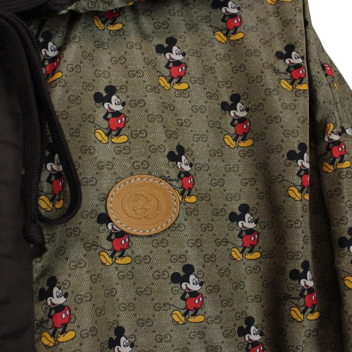 Gucci x Disney khaki brown windbreaker jacket with monogram pattern and nylon material.
