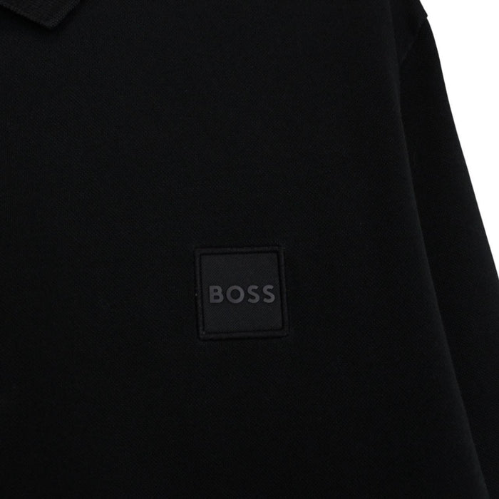 Hugo Boss black long sleeve polo shirt, slim fit, cotton material, subtle wear marks.