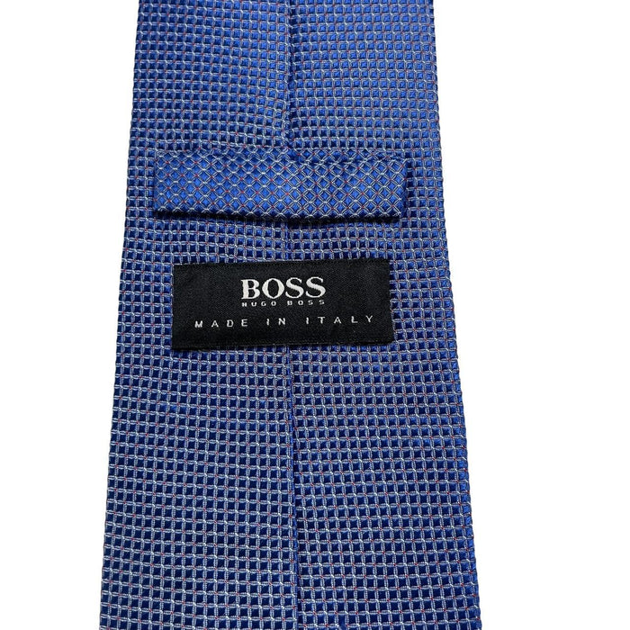 Hugo Boss blue silk tie with smooth texture and subtle sheen.