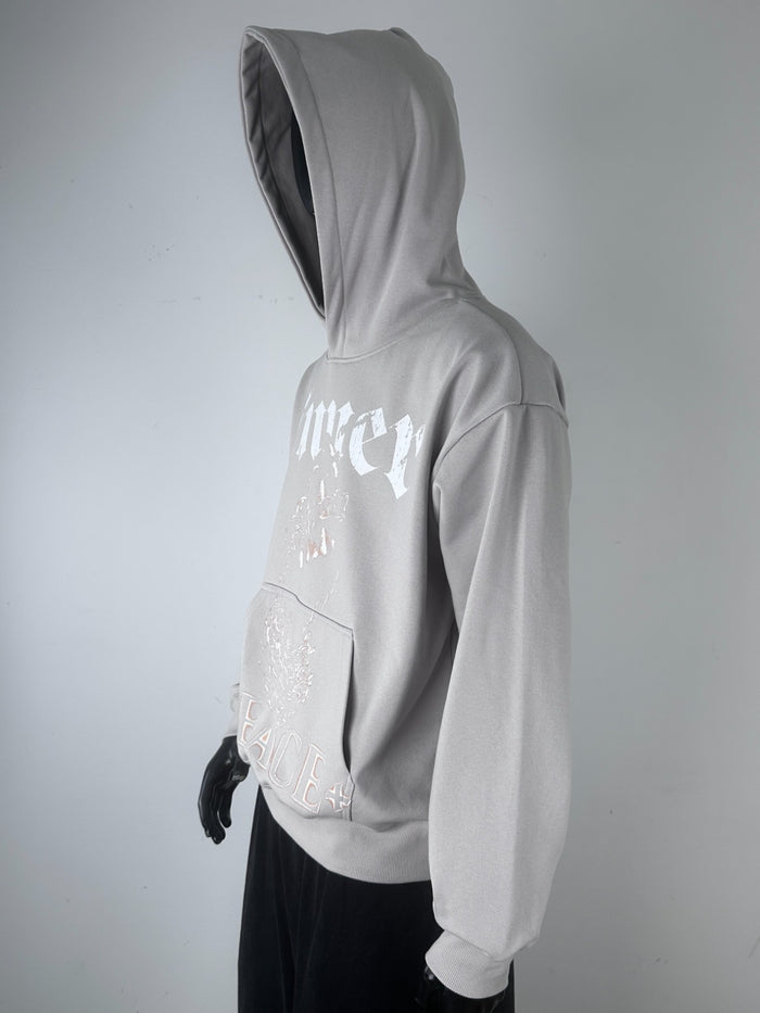 Inner Peace Soul pullover hoodie in cement color, featuring a soft fabric and relaxed fit, displayed on a hanger.