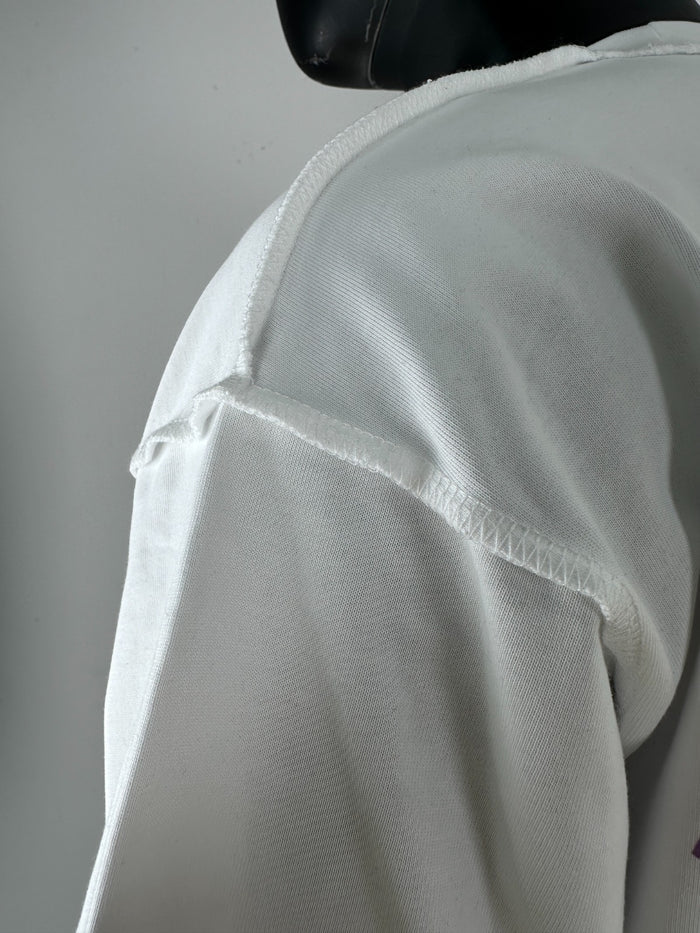 White Inner Peace Wings Of Power oversized cropped T-shirt with bold graphic design on the front.
