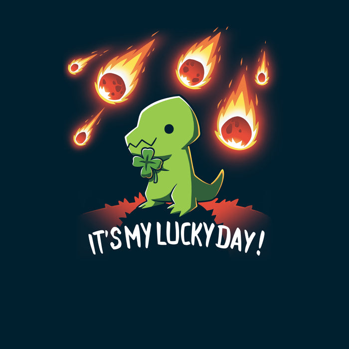 Premium Cotton T-shirt_TeeTurtle navy blue It's My Lucky Day featuring a dinosaur holding a four-leaf clover while meteors fall from the sky. The text below reads, "It's my lucky day!".