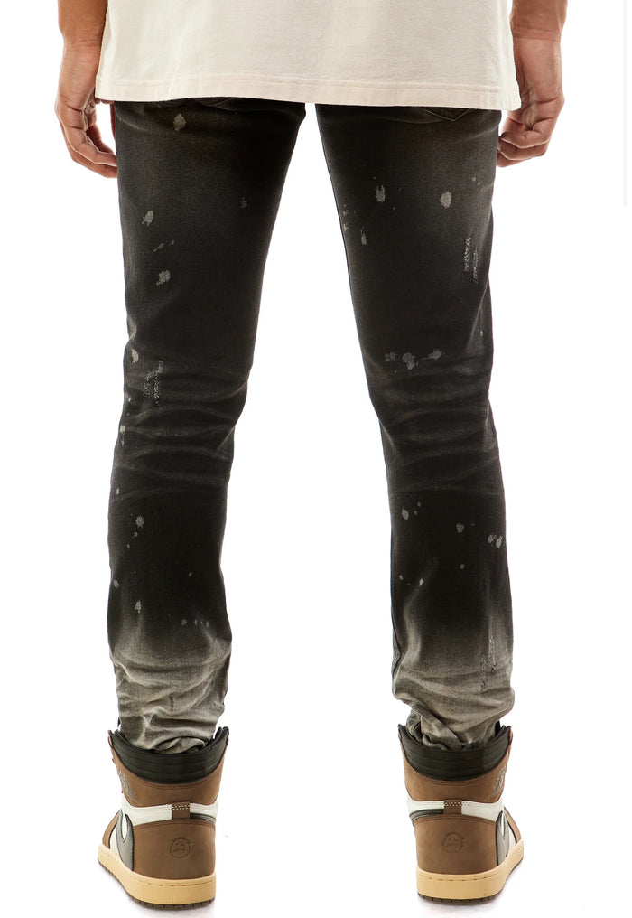 KDNK Ombre Bleached Black Denim jeans showing faded black and ombre effect, slim fit style, with classic denim texture.