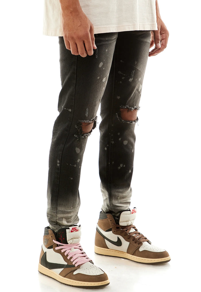KDNK Ombre Bleached Black Denim jeans with faded ombre effect and classic denim texture.
