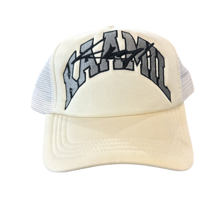 Cream KML ‘ARC' Trucker Hat by KAAMIL with mesh back and curved brim, casual style perfect for everyday wear.