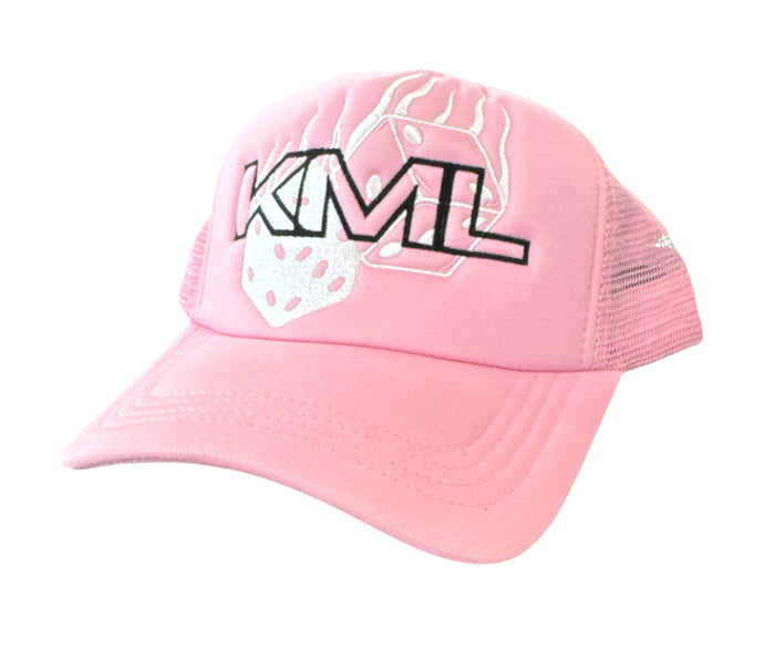 Pink KML ‘RISK’ trucker hat by KAAMIL featuring a structured crown and curved brim, casual headwear for stylish sun protection.