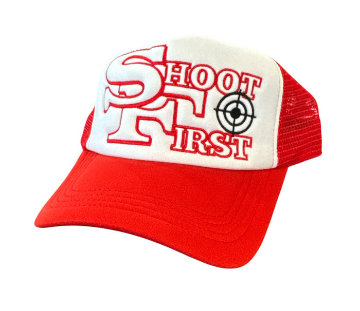 White and red KML ‘SF’ trucker hat by KAAMIL featuring mesh back and adjustable snap closure.