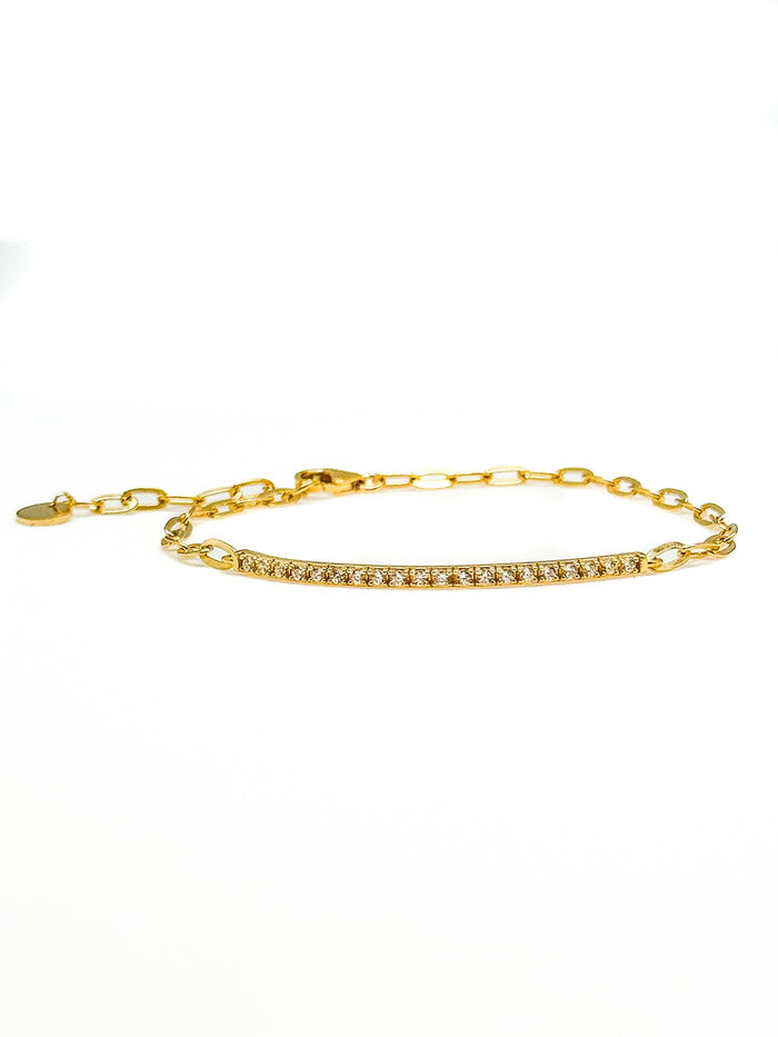 Gold plated sterling silver pavé bar bracelet photographed on a white background