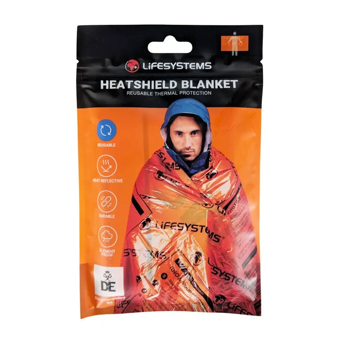 Lifesystems Heatshield Thermal Blanket in a bright orange resealable pouch with a black top header. The packaging features a photo of a man wrapped in the orange reflective blanket, with product features listed on the left side.