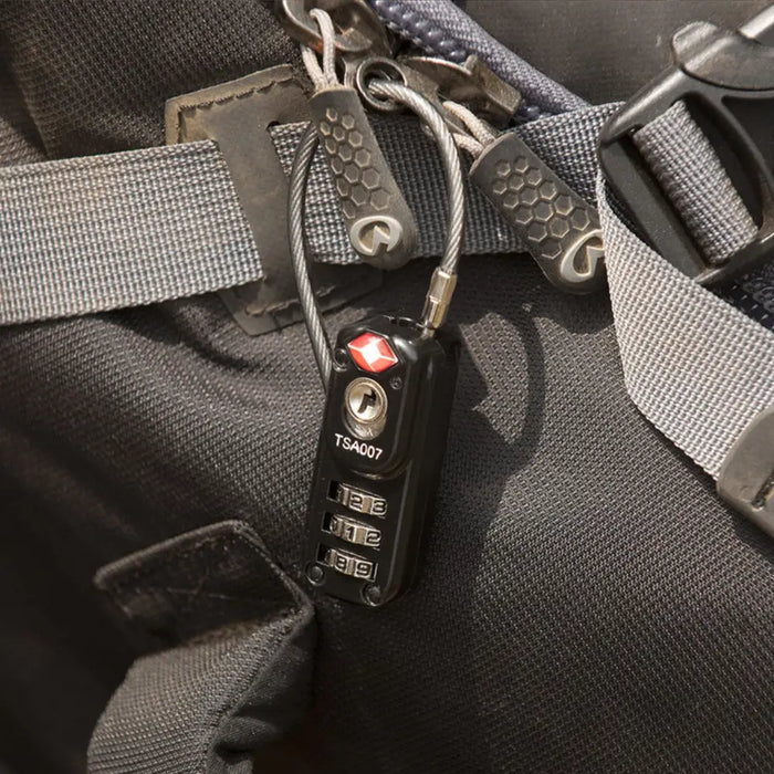 Close-up of a  Lifeventure TSA approved padlock attached to a backpack zip