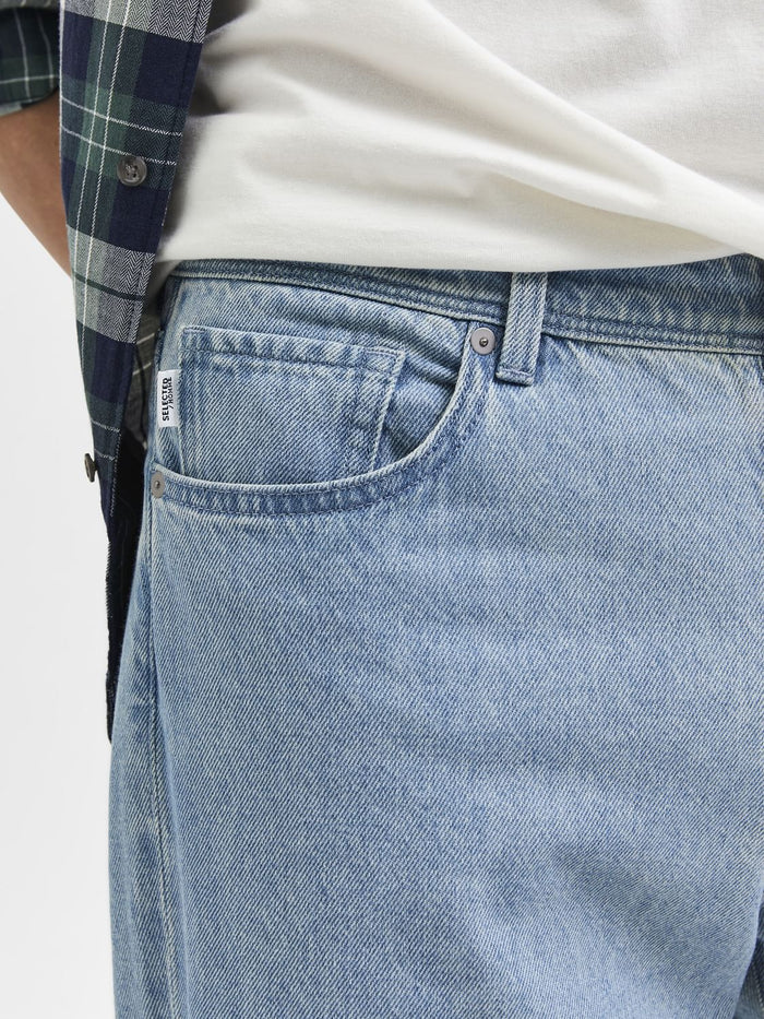 Light Blue Mid Rise Relaxed Jeans