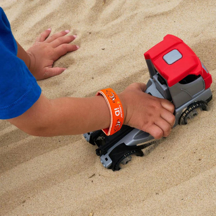 Lifestyle shot of a child playing with their Littlelife Clownfish identification wristband