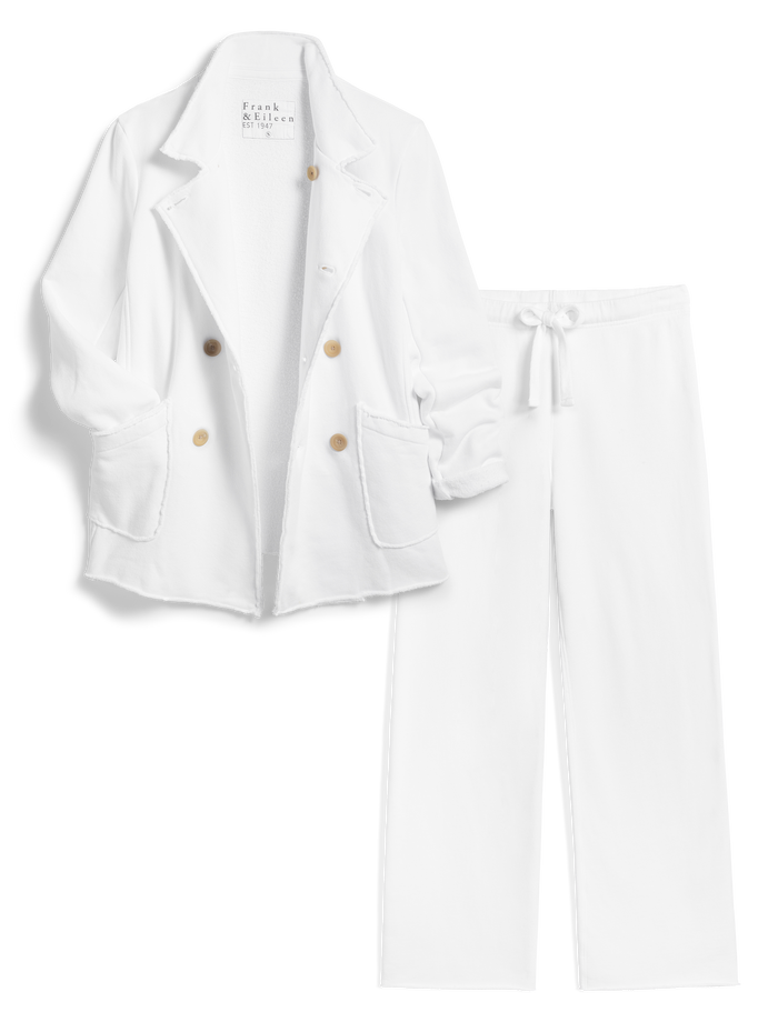 White suit with light brown buttons on a white background