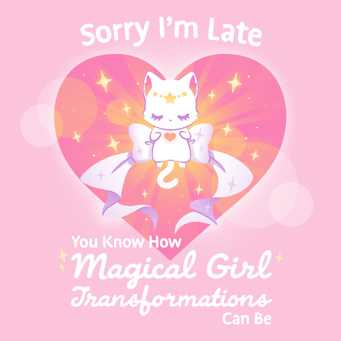 Premium Cotton T-shirt_TeeTurtle light pink Magical Girl Transformations apparel featuring a cat floating in a heart with a large bow and sparkles like classic anime girl. Captions says, "Sorry I'm late, you know how magical girl transformations can be".