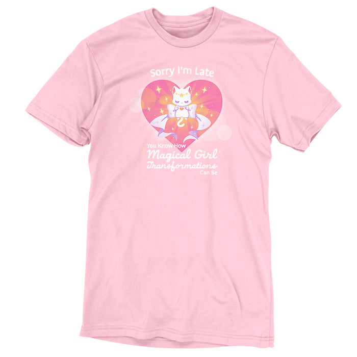 Premium Cotton T-shirt_TeeTurtle light pink Magical Girl Transformations apparel featuring a cat floating in a heart with a large bow and sparkles like classic anime girl. Captions says, "Sorry I'm late, you know how magical girl transformations can be".