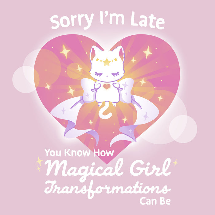 Classic Cotton T-shirt_TeeTurtle light pink Magical Girl Transformations apparel featuring a cat floating in a heart with a large bow and sparkles like classic anime girl. Captions says, "Sorry I'm late, you know how magical girl transformations can be".