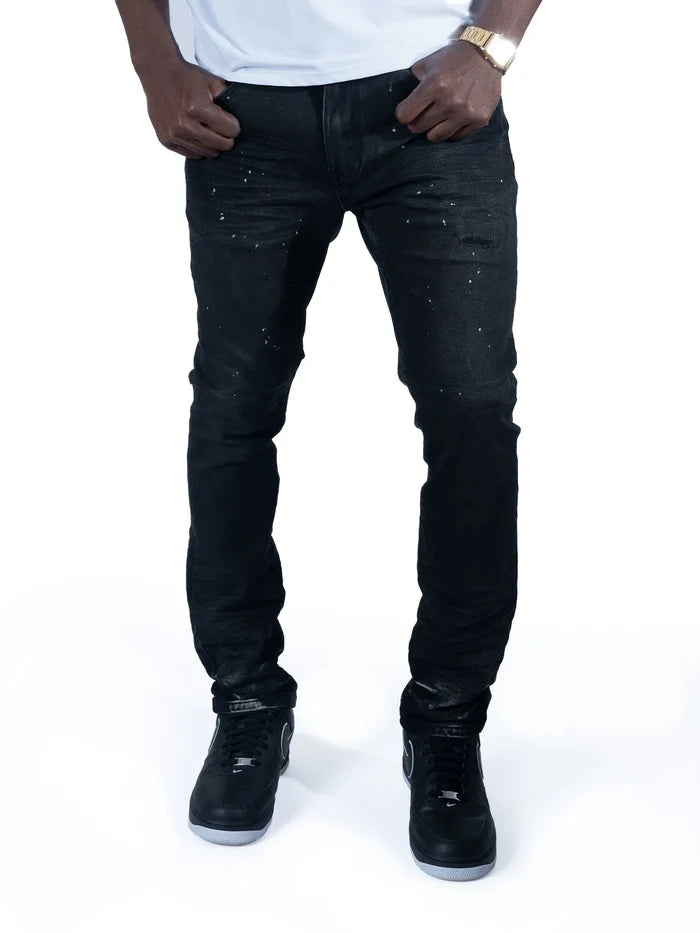 Makobi Avenida Grease jet black denim jeans, slim fit style, shown on a model with pockets and belt loops.