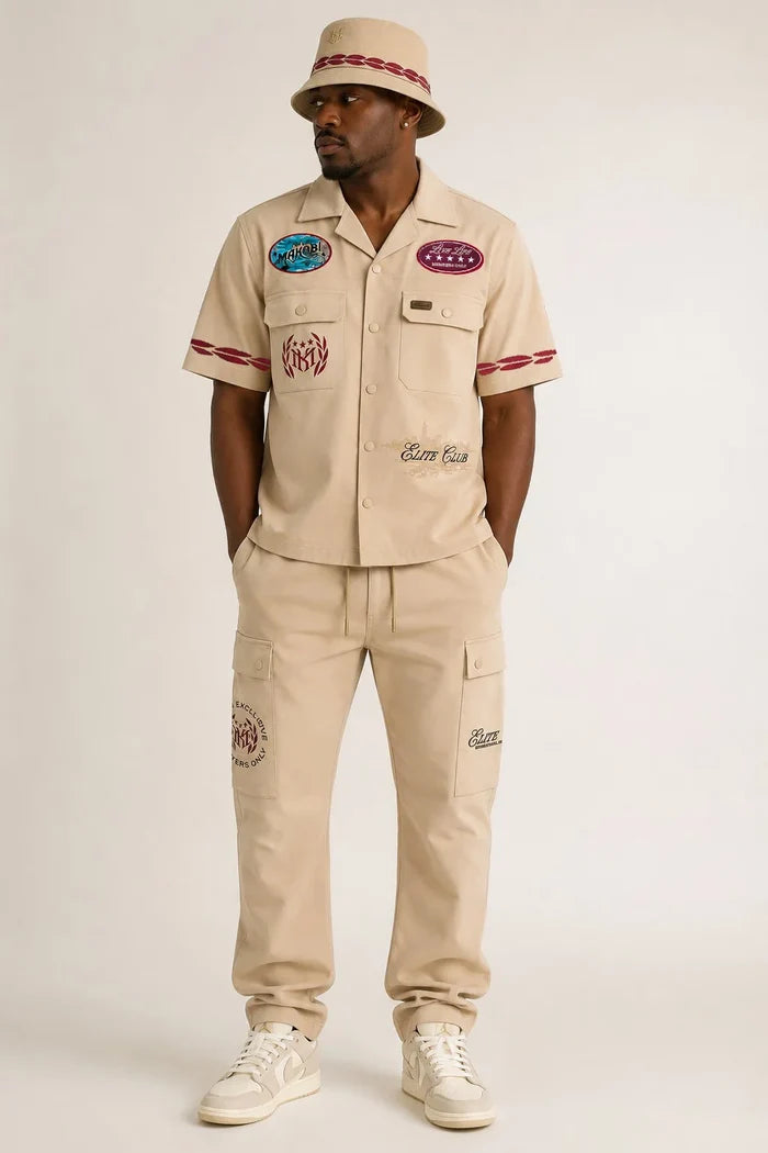 Makobi Elite Club stacked twill pants in khaki, showing a tailored fit and stacked design with belt loops and front pockets.