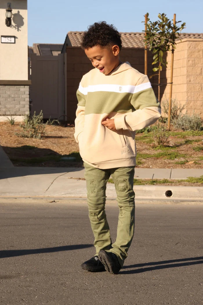 Makobi Kids olive monogram denim for kids, showing front view of stylish denim jeans with monogram detail.