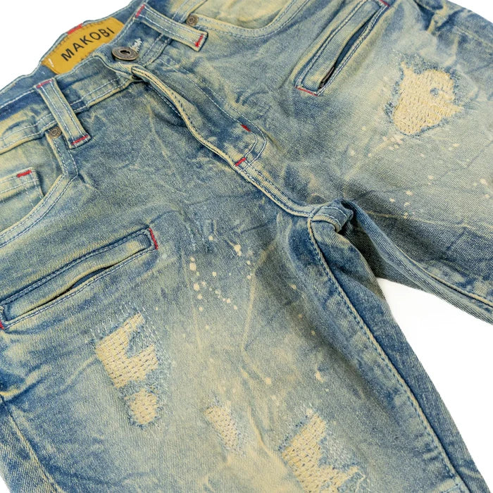 Makobi Kids Rick Biker denim jeans for kids in dirt wash with distressed details and classic biker style.