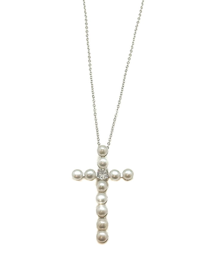 Pearl cross necklace on a white background