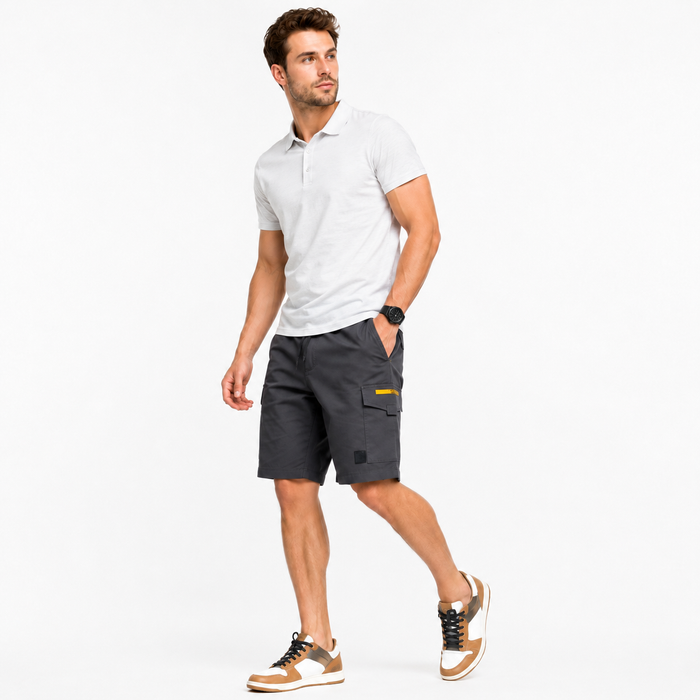 Man wearing a white polo shirt and gray shorts on a white background
