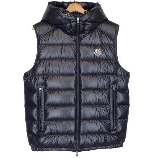 Moncler navy blue hooded nylon down gilet with logo and quilted texture.