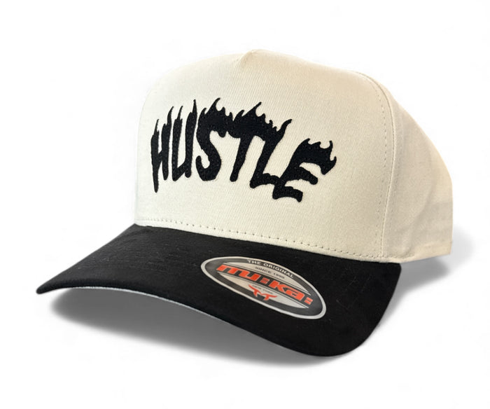 MUKA Hustle snapback hat in ivory and black with adjustable strap and embroidered logo on front, accessory for casual style.