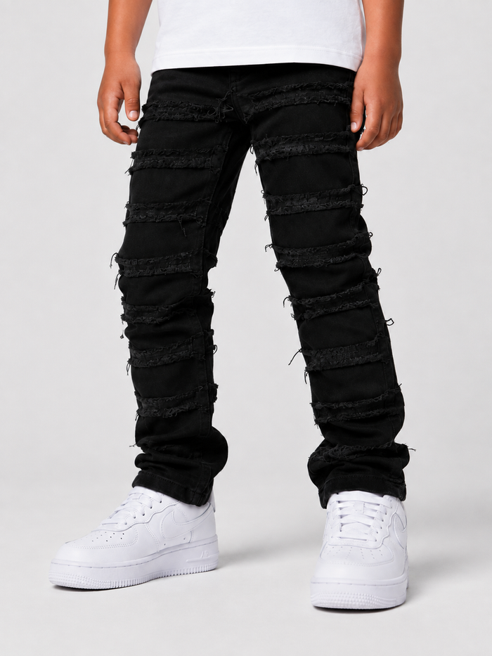 Kids denim jeans by OPS KIDS with frayed hem and taped trim in jet black, featuring a comfortable, stylish fit for children.