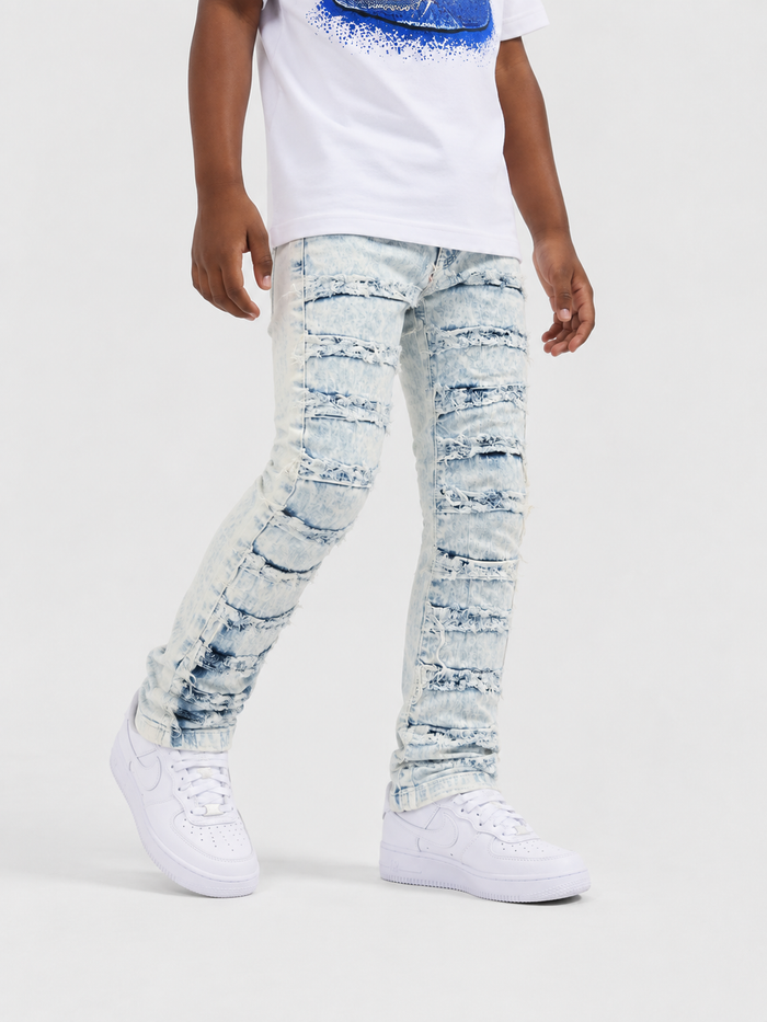 Kids denim jeans by OPS KIDS with frayed hems and taped trim in bleach wash, casual and stylish for children.