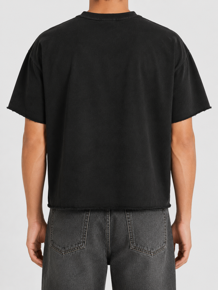 Black Papercut 'Eternity' oversized cropped T-shirt displayed on a hanger, showcasing its relaxed fit and modern style.