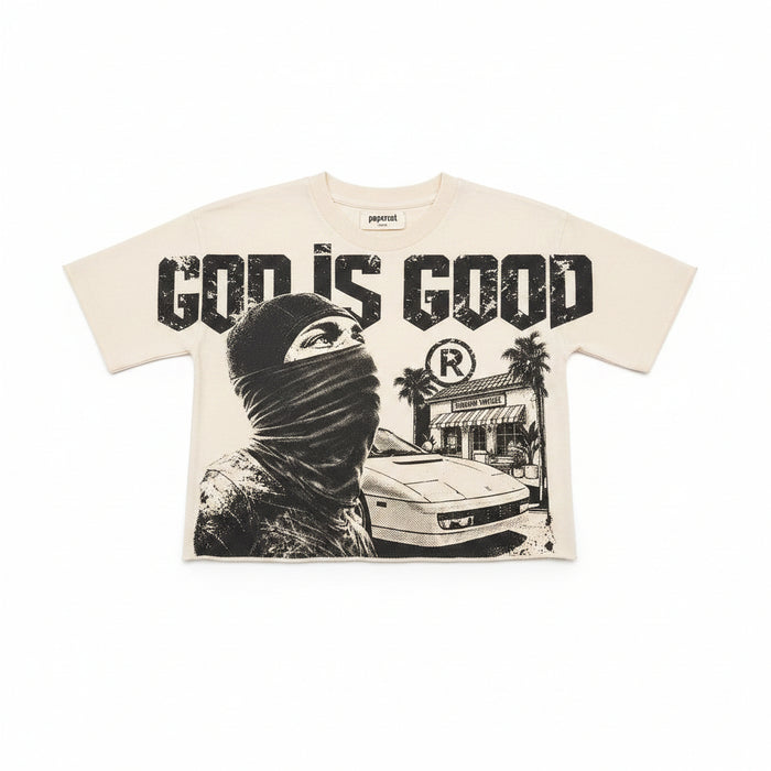 Cream Papercut 'God is Good' oversized cropped T-shirt with bold black text on the front, casual and stylish fit.