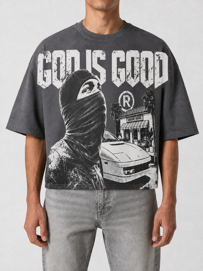Grey Papercut 'God is Good' oversized cropped T-shirt with bold printed text and relaxed fit.
