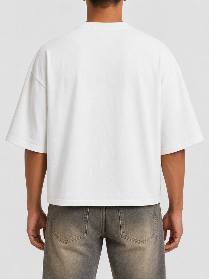 White Papercut Redemption oversized cropped T-shirt with a relaxed fit and bold design, perfect for casual streetwear style.