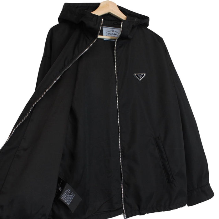 Prada black hooded jacket with full zip, Re-Nylon material, logo detail on sleeve.